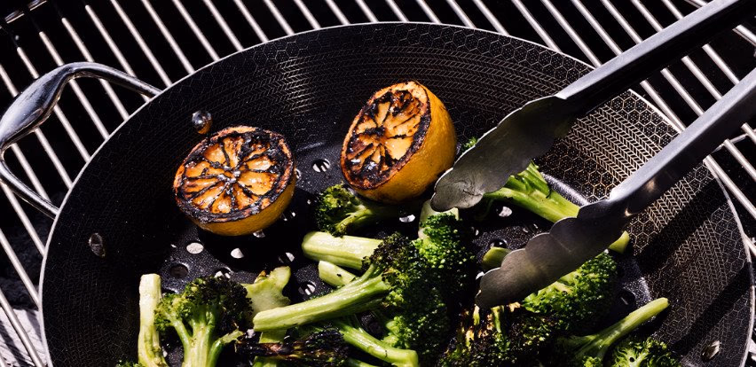 HexClad pan cooking broccoli showcasing the cookware brand